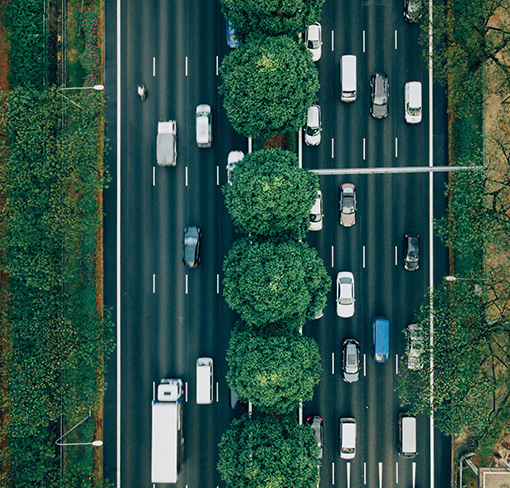 Overhead image of a highway with cars traveling.